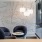 a room with a table chairs and a wall with lights