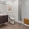 a bathroom with a tub toilet and sink