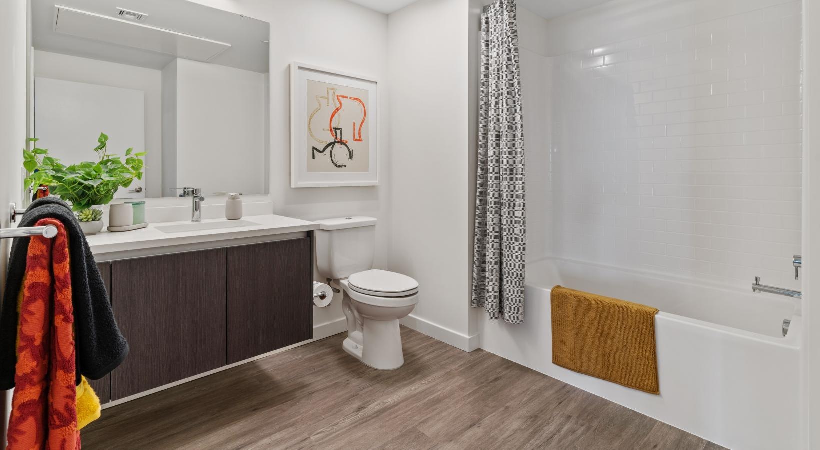 Spacious bathrooms with everything you need a bathroom with a tub toilet and sink