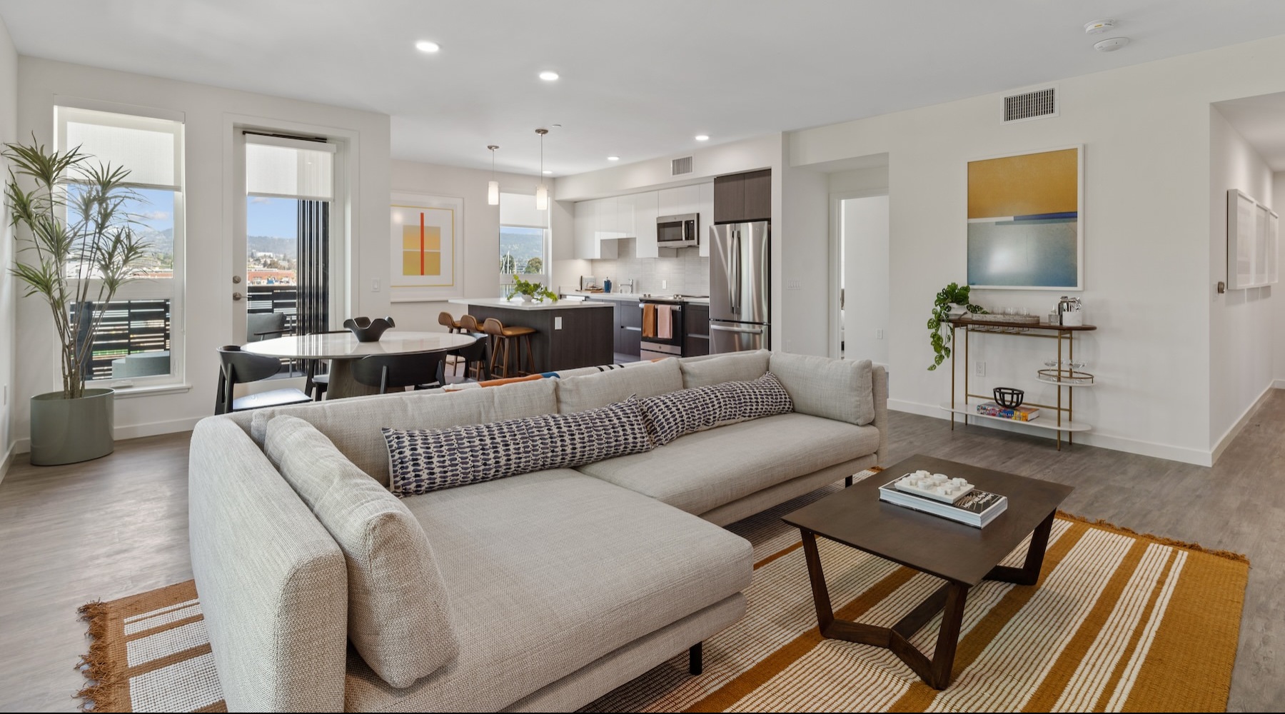 Wide-open living areas to entertain an enjoy Open-concept floorplan with modern design at Launch Alameda apartments for rent.
