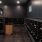 a large room with black cabinets