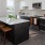 Kitchen with island, barstools, and large window at Launch best apartments in San Francisco.