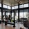 a room with exercise equipment and windows