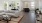 a large living room with a large white couch and a table